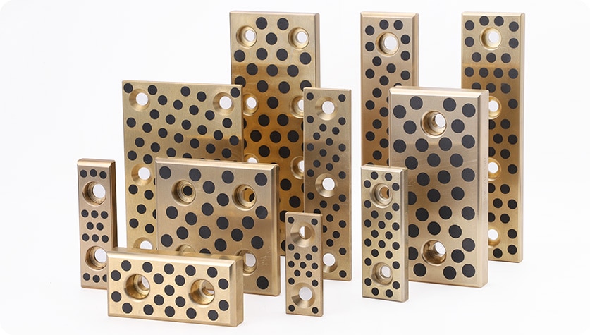 Quali sono i principali vantaggi dell'utilizzo di cuscinetti autolubrificanti rispetto ai cuscinetti standard con lubrificazione a grasso o olio?